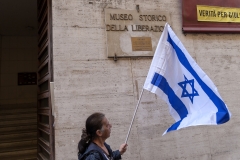 A man flies an Israeli flag. (Photo credit: Stefano Montesi - Corbis/Corbis via Getty Images)