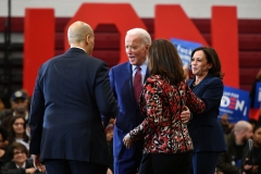 Democratic presidential candidate Joe Biden (C) greets New Jersey Senator Cory Booker (L) as California Senator Kamala Harris (L) and Michigan Governor Gretchen Whitmer (R) cheer during a campaign rally at Renaissance High School in Detroit, Michigan on March 9, 2020. (Photo credit: MANDEL NGAN/AFP via Getty Images)