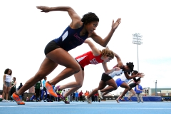 High school athletes at the start of the 100m race during the 2013 NYC Mayor's Cup Outdoor Track and Field Championships. (Photo credit: Tim Clayton/Corbis via Getty Images)