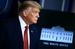 President Trump holds a press briefing at the White House on Monday. (Photo by Brendan Smialowski/AFP via Getty Images)