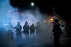 Tear gas fills the air in Portland, Oregon, as protests, often violent or destructive, enter a third month. (Photo by ALISHA JUCEVIC/AFP via Getty Images)