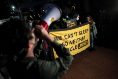A group of demonstrators protests outside the home of U.S. Sen. Lindsay Graham (R-SC) on the early morning of Sept. 21, 2020 in Washington, D.C. (Photo credit: ALEX EDELMAN/AFP via Getty Images)