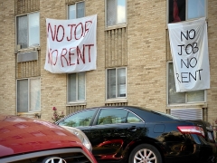 Banners against renters eviction reading "no job, no rent" is displayed on a controlled rent building in Washington, D.C. (Photo credit: ERIC BARADAT/AFP via Getty Images)