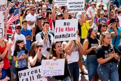 Hundreds of people of mixed political views, religions, and cultures protest a mandate from the Massachusetts governor requiring all children age K-12 to receive an influenza (flu) vaccine/shot to attend school for the 2020-2021 year. (Photo credit: JOSEPH PREZIOSO/AFP via Getty Images)