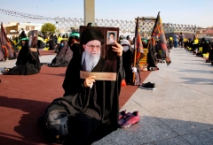 Men hold pictures of the Iranian Supreme Leader Ayatollah Ali Khamenei , during a protest against the reprinting of the cartoon of the Prophet Mohammad by French magazine Charlie Hebdo, at the Imam Hussein square in the capital Tehran, on September 10, 2020. (Photo by AFP via Getty Images)