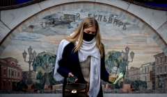 A woman wearing a face mask to protect against the coronavirus disease walks out of an underground crossing at Tverskaya metro station in central Moscow on October 26, 2020. (Photo by YURI KADOBNOV/AFP via Getty Images)