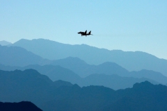  An Indian Air Force fighter jet flies over a mountain range at the India-China border on September 15, 2020. (Photo by MOHD ARHAAN ARCHER/AFP via Getty Images)