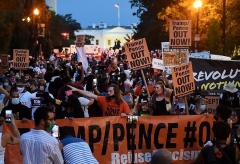 Demonstrators protest at Black Lives Matter Plaza across from the White House in August. (Photo by Olivier Douliery/AFP via Getty Images)