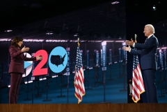 Sen. Kamala Harris and former Vice President Joe Biden socially distance at the Democratic National Convention. (Photo credit: OLIVIER DOULIERY/AFP via Getty Images)