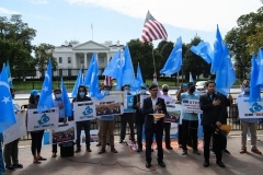 Uyghurs hold a rally near the White House in October. (Photo by Nicholas Kamm/AFP via Getty Images)