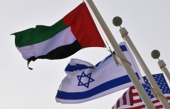 The Israeli, UAE and United States national flags fly at Abu Dhabi airport. (Photo by Karim Sahib/AFP via Getty Images)