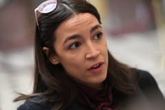 Rep. Alexandria Ocasio-Cortez (D-N.Y.), a Bernie Sanders supporters, skipped President Joe Biden's inauguration, partly because of security concerns, she said. (Photo by SAUL LOEB/AFP via Getty Images)