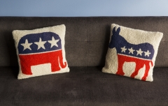 Pillows bearing the Republican elephant and Democratic donkey sit on a couch. (Photo credit: Brooks Kraft LLC/Corbis via Getty Images)