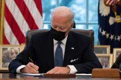 President Joe Biden signs an executive order reversing Trump era ban on transgenders serving in the military. (Photo credit: JIM WATSON/AFP via Getty Images)