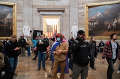 Supporters of US President Donald Trump walk around in the Rotunda after breaching the US Capitol on January 6, 2021. (Photo by SAUL LOEB/AFP via Getty Images)