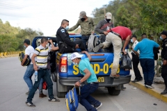 Guatemalan police officers return illegal Honduran immigrants to their country, in El Florido, in the Honduran department of Copan across their border, as migrants wanting to reach the United States start gathering with the hope of crossing the border into Guatemala to begin the first US-bound caravan of the year, on January 15, 2021. (Photo by JOHAN ORDONEZ/AFP via Getty Images)