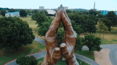 Featured is the "Praying Hands" statue at Oral Roberts University. (Photo credit: YouTube/Oral Roberts University)