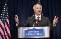 Asa Hutchinson announces the findings and recommendations of the National School Shield Program at the National Press Club. (Photo credit: JIM WATSON/AFP via Getty Images)