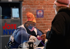 An individual registers to vote. (Photo credit: ANGELA WEISS/AFP via Getty Images)