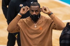 eBron James of the Los Angeles Lakers on the bench during their game against the Charlotte Hornets at Spectrum Center on April 13, 2021 in Charlotte, North Carolina. (Photo by Jacob Kupferman/Getty Images)