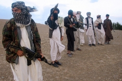 In this picture taken on September 26, 2008, Fighters with Afghanistan's Taliban militia stand on a hillside at Maydan Shahr in Wardak province, west of Kabul. (Photo by STR/AFP via Getty Images)