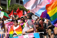 Protesters march ahead of the Sydney Gay and Lesbian Mardi Gras parade as they campaign for LGBTQI rights along Oxford Street on March 06, 2021 in Sydney, Australia. Protest organisers were given a COVID-19 exemption by NSW Health on Friday to be able to hold the event, allowing up to 1500 people to be able to participate. (Photo credit: James D. Morgan/Getty Images)