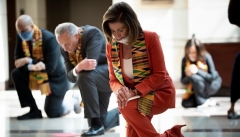 House Speaker Nancy Pelosi and other Democrats kneel to observe a moment of silence for George Floyd on Capitol Hill in June 2020. (Photo by Brendan Smialowski/AFP via Getty Images)