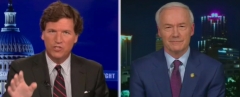 Tucker Carlson speaks with Arkansas Gov. Asa Hutchinson. (Photo credit: Fox News)