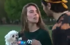 Jack Ring leans in to kiss Gillian McKeown, whom he does not know. (Photo credit: YouTube/Women In Canadian Politics)