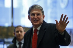 Sen. Joe Manchin (D-WV) leaves after a meeting with Donald Trump. (Photo credit: KENA BETANCUR/AFP via Getty Images)