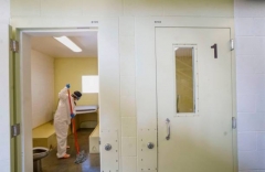 Inmate cleans a cell at Las Colinas Women's Detention Facility in Santee, Calif., April 22, 2020. (Photo by Sandy Huffaker/AFP via Getty Images)