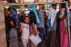 Eritrean refugees line up for a distribution of items organized the United Nations High Commissioner for Refugees (UNHCR) in Ethiopia on January 30, 2021. (Photo by EDUARDO SOTERAS/AFP via Getty Images)