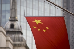 The Chinese national flag hangs from the Bank of China's offices in the City of London, England UK. (Photo credit: In Pictures Ltd./Corbis via Getty Images)