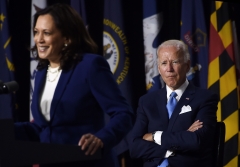 Kamala Harris and Joe Biden give a speech. (Photo credit: OLIVIER DOULIERY/AFP via Getty Images)