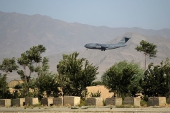 A U.S. Air Force transport plane lands at the Bagram airbase on Thursday, hours before what had been the biggest U.S. military base in Afghanistan over the past 20 years was vacated. (Photo by Wakil Kohsar/AFP via Getty Images)