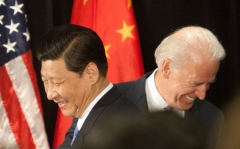 Featured are American and Chinese heads Joe Biden and Xi Jinping. (Photo credit: Tim Rue/Corbis via Getty Images)