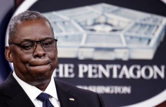 Defense Secretary Gen. Lloyd Austin briefs reporters at the Pentagon on Wednesday. (Photo by Olivier Douliery/AFP via Getty Images)