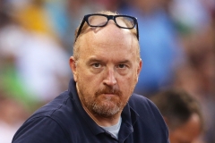 Comedian Louis C.K. cheers during the Boston Red Sox vs Texas Ranger game at Fenway Park on July 6, 2016 in Boston, Mass. (Photo credit: Adam Glanzman/Getty Images)