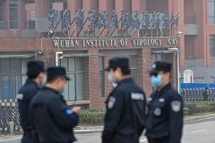 Chinese security personnel outside the Wuhan Institute of Virology in Wuhan, which is at the center of controversy over the theory that the coronarivus may have leaked accidentally from a lab. (Photo by Hector Retamal/AFP via Getty Images)