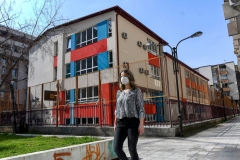 A masked woman walks during the coronavirus pandemic. (Photo credit: ROBERT ATANASOVSKI/AFP via Getty Images)
