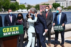 Rep. Alexandria Ocasio-Cortez (D-N.Y.) embraces Sen. Ed Markey, (D-Mass), after re-introducing the Green New Deal on April 20, 2021. (Photo by MANDEL NGAN/AFP via Getty Images)