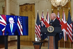 President Biden watches as Australian Prime Minister Scott Morrison speaks during Wednesday’s joint announcement. British Prime Minister Boris Johnson, out of frame, also participated by video link. (Photo by Brendan Smialowski / AFP via Getty Images)