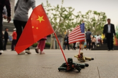 Pictured are Chinese and American toy soldiers. (Photo credit: PETER PARKS/AFP/GettyImages)