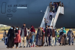 Refugees disembark from a US air force aircraft after an evacuation flight from Kabul at the Rota naval base in Rota, southern Spain, on August 31, 2021. (Photo by CRISTINA QUICLER/AFP via Getty Images)