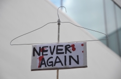 A pro-abortion activist holds up a hanger during a rally to protest new restrictions on abortions, May 21, 2019, in West Hollywood, Calif. (Photo credit: ROBYN BECK/AFP via Getty Images)
