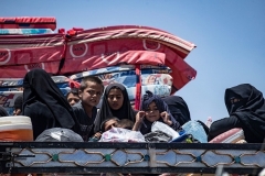 Syrian women and children from the Al-Hol camp in the northeastern Syria. (Photo by Delil Souleiman/AFP via Getty Images)