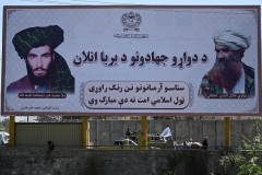 A billboard in Kabul features large pictures of the late Taliban founder Mohammed Omar and the late Haqqani Network founder Jalaluddin Haqqani. (Photo by Aamir Qureshi/AFP via Getty Images)