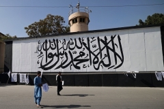 A large Taliban flag, bearing in Arabic the words 'There is no god but Allah and Mohammed is his messenger,' has been painted on a wall outside the U.S. Embassy compound in Kabul. (Photo by Karim Sahib/AFP via Getty Images)