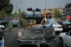 Taliban fighters patrol a street in Kabul. (Photo by Hoshang Hashimi/AFP via Getty Images)