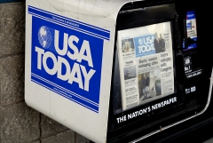 Featured is a USA Today newspaper stand. (Photo credit: Francis Dean/Corbis via Getty Images)